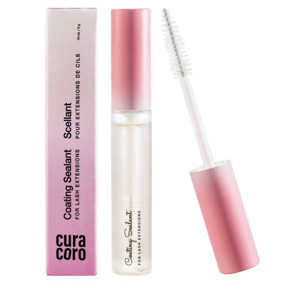 An open lash sealant tube with a pink ombre cap, clear applicator wand, and matching box displayed on a white background.