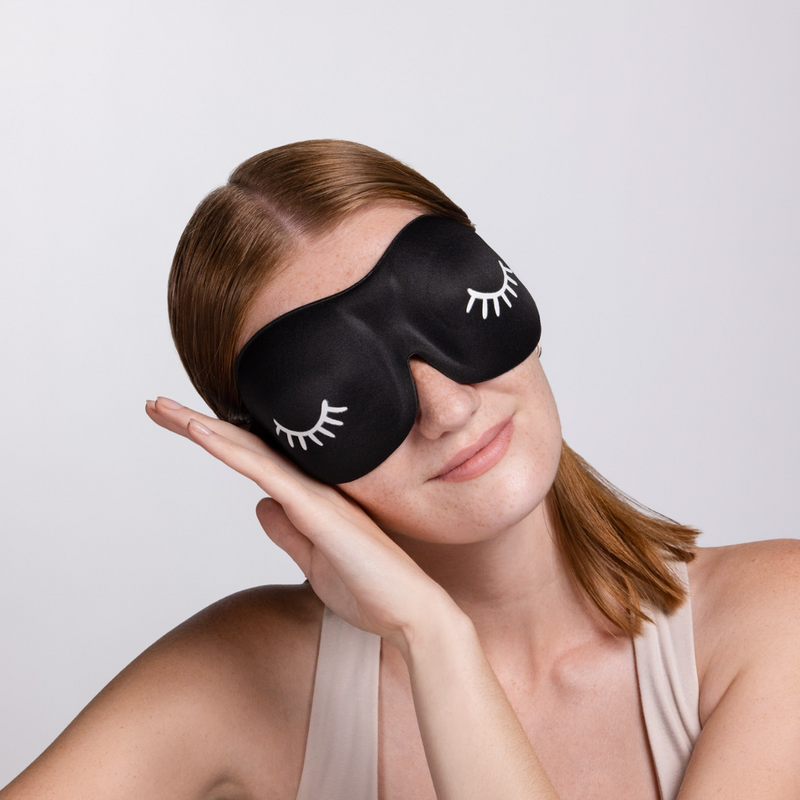 A model wearing 3D foam eye mask. 