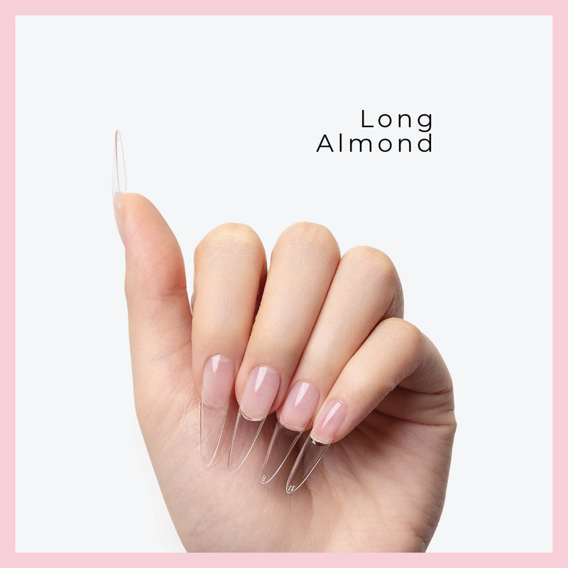 Curacoro Long Almond Soft Gel Nail Tips on a hand, featuring natural nails with clear extensions, set against a light gray background with a pink border.