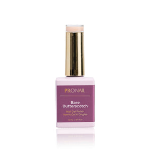 A Bare Butterscotch nail polish bottle with a gold cap casting a shadow on a white background.
