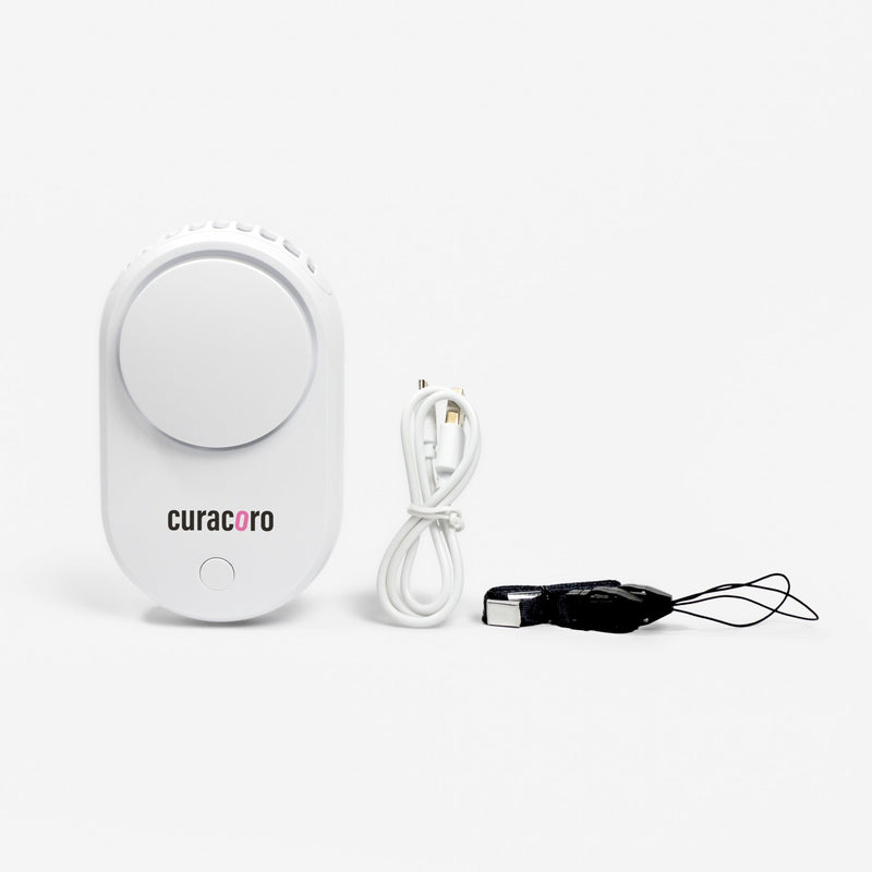 Curacoro bladeless eyelash fan with USB cable and wrist strap on white background.