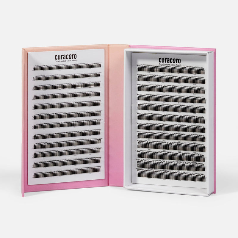 Open Curacoro Lashfolio with two trays of narrow promade lash fans on a white background.