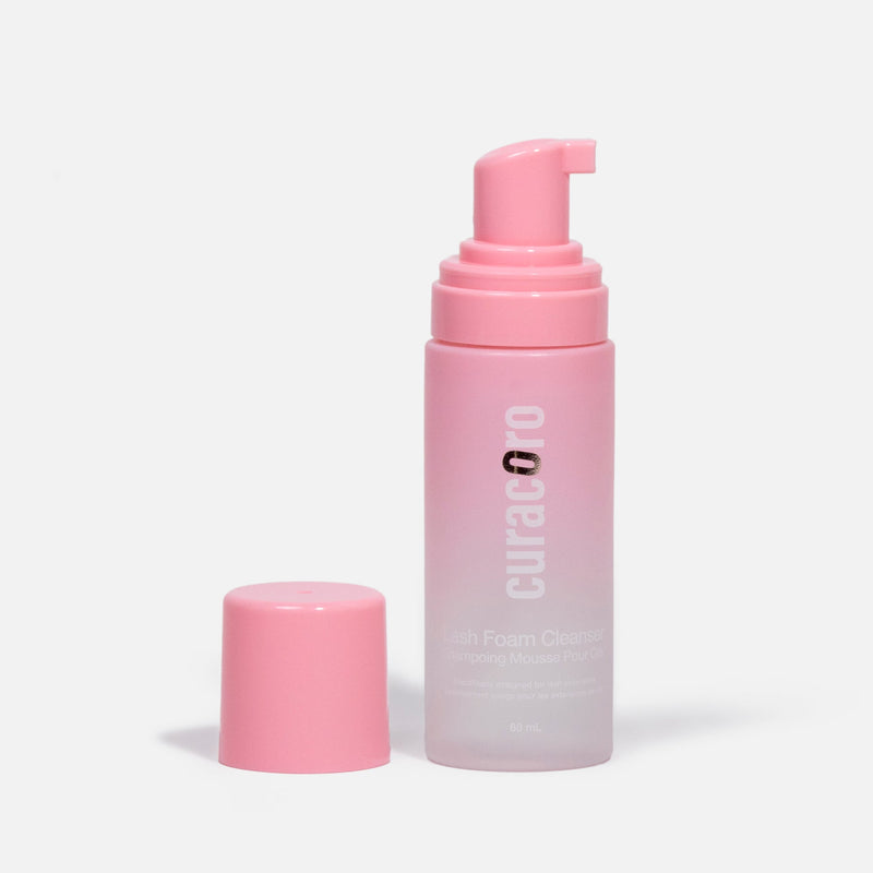 Curacoro lash foam cleanser with pink pump and cap, 60 ml, on a white background.