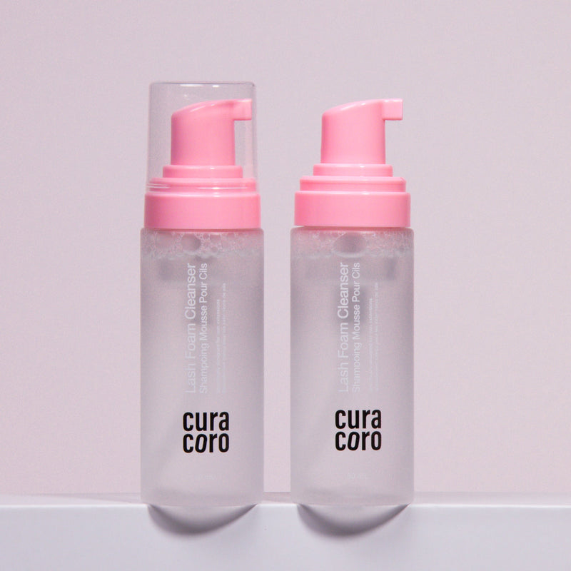 Two bottles of Curacoro Lash Foam Cleanser with pink pumps.