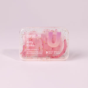 Curacoro Violet Visors lash lift shields in a transparent case featuring 8 pairs of thin teardrop-shaped shields.