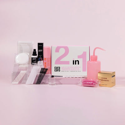 Curacoro 2in1 kit with tools and accessories for lash lifting and tinting on a pink background.