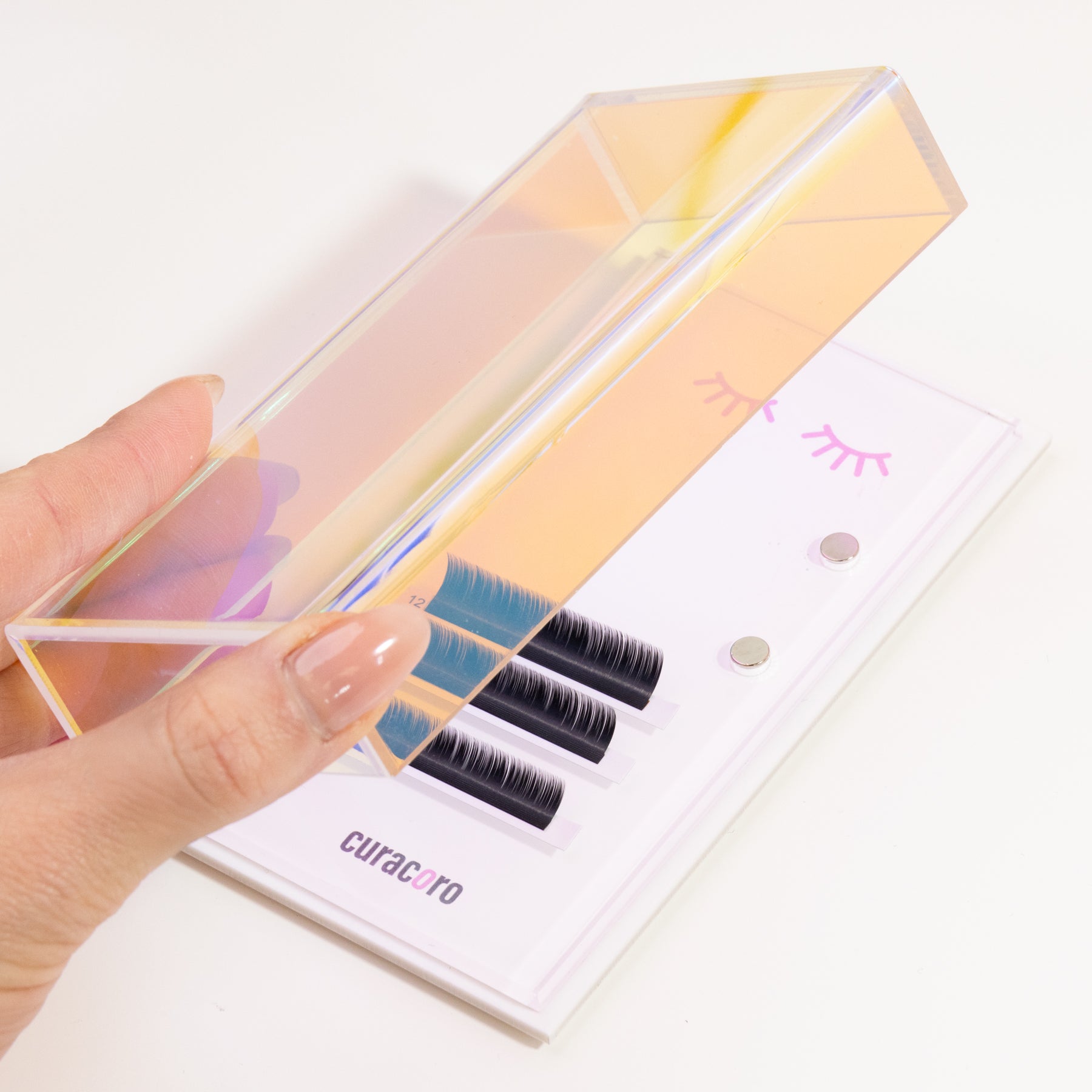 Curacoro magnetic lash tile with holographic cover, featuring labeled lash strips for organized application.