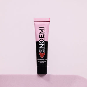 Noemi Hybrid Brow & Lash Dye - Mahogany Bottle Over Pink Background