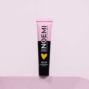 Noemi Hybrid Brow & Lash Dye - Yellow (Corrector) Bottle Over Pink Background