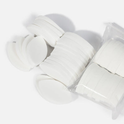 Stack of White Lash Practice Sponge pieces, shown in a semi-circle and packaged arrangement.