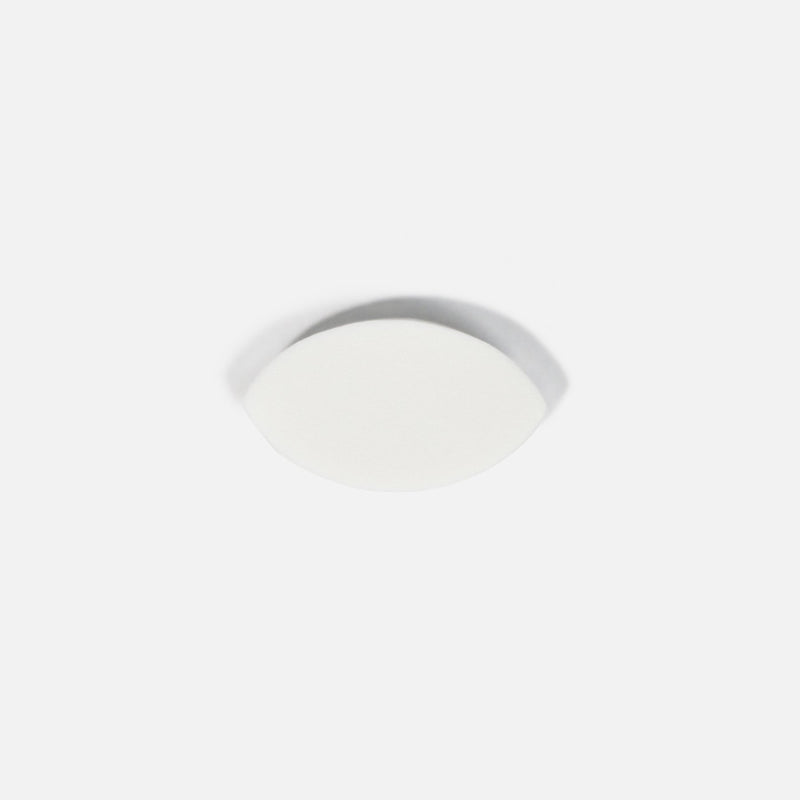 a White Lash Practice Sponge over a white background. 