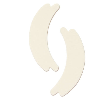 Two hypoallergenic foam under-eye pads on a white background.