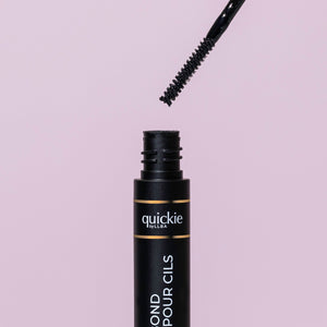 Quickie Lash Bond in Black features a precise spoolie applicator, offering strong, seamless hold for lash extensions.
