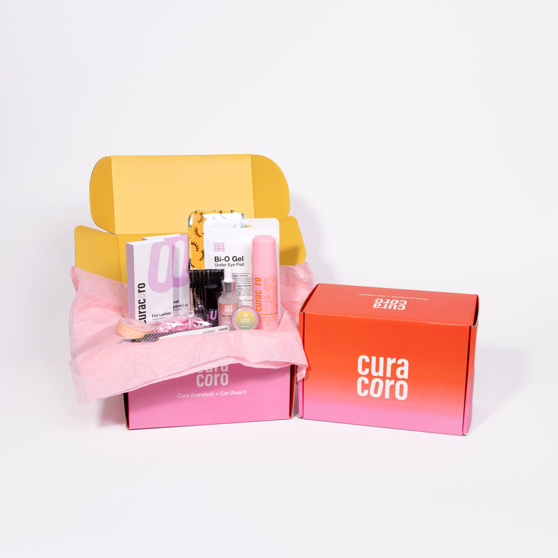 Curacoro Eyelash Extension Training Kit displayed with packaging and tools in a pink and yellow open box on a white background.