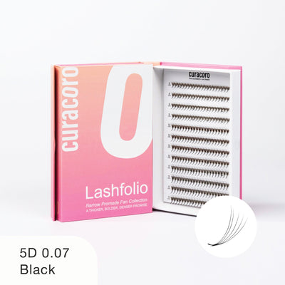 Curacoro Lashfolio 5D 0.07 Black lashes in pink gradient packaging with open tray showcasing lightweight, voluminous lash fans.