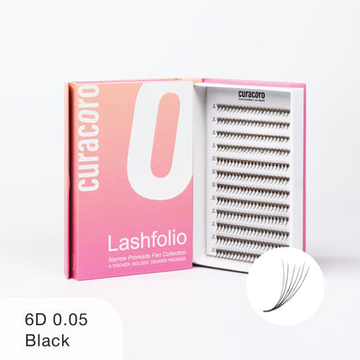 Curacoro Lashfolio 6D 0.05 Black lashes in pink gradient packaging with open tray showcasing lightweight, voluminous lash fans.