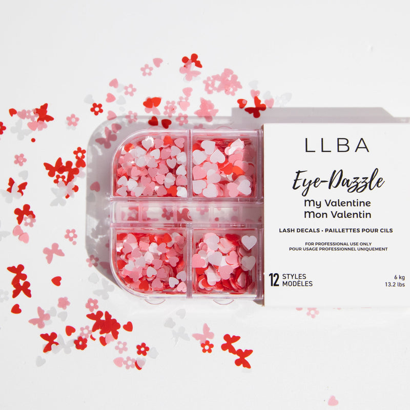 LLBA Eye-Dazzle My Valentine lash decals in red, pink, and white heart shapes, with 12 unique styles for professional use, scattered on a white background.