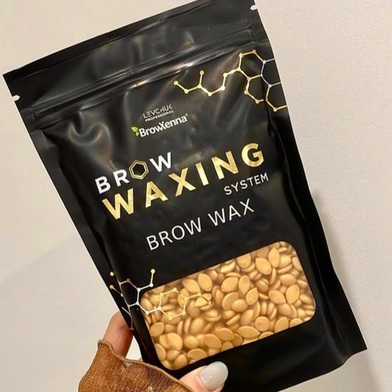 BrowXenna® Brow Wax in black pack held in hand 