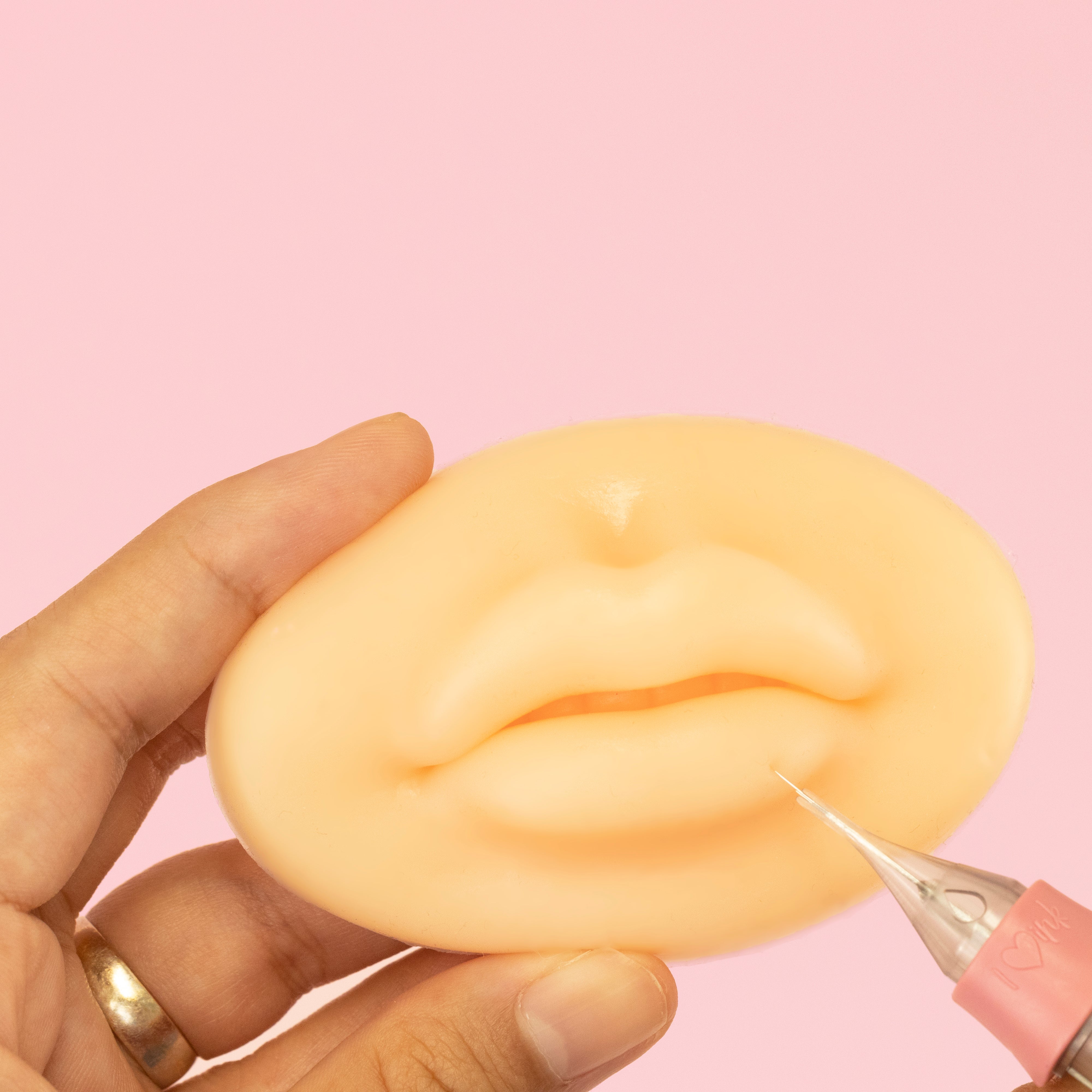 White style of 3D Silicone Lips standing in front of a pink background.