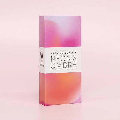 Curacoro Neon & Ombré lash packaging with a premium gradient design in pink and orange tones, labeled 'Cruelty-Free' and 'Premium Quality,' displayed on a soft pink background.