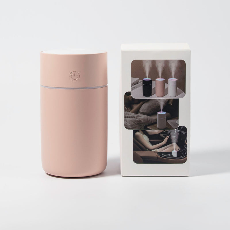 Image of the humidifier with its box with a white background. 