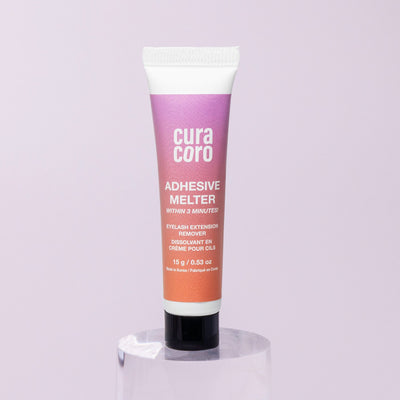  Curacoro adhesive melter eyelash extension remover tube on a light background.