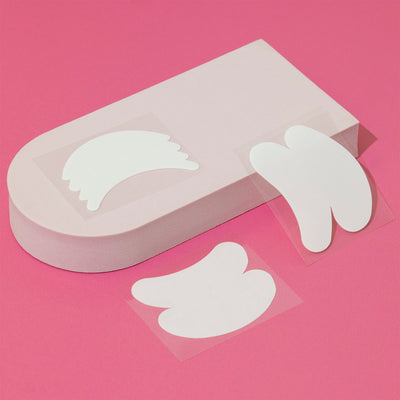 Various Bio Gel Eye Pads, including styles 1, 2, and 3, set against a pink backdrop