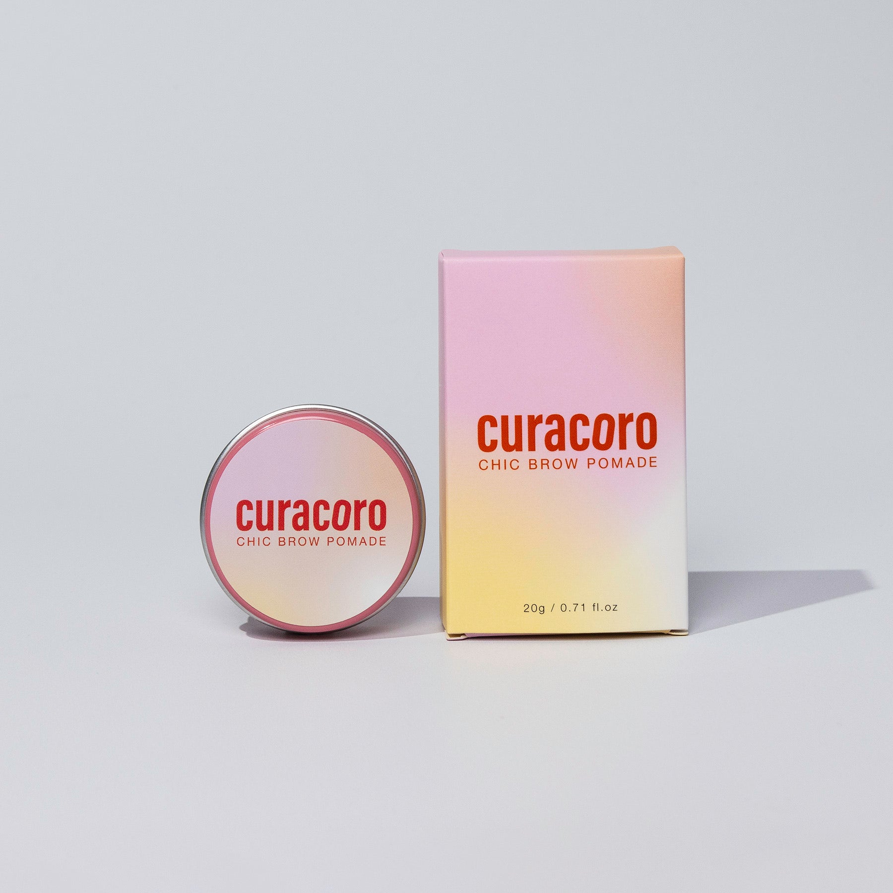 Curacoro Chic Brow Pomade in front of a white background.