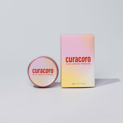 Curacoro Chic Brow Pomade in front of a white background.