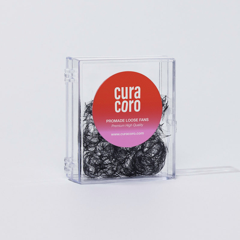 A clear box of Curacoro Promade Loose Fans with premium quality lash extensions.