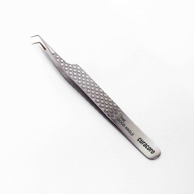 Curacoro precision tweezers with a diamond-textured grip and angled tips, labeled 'The Good Angle,' on a white background.