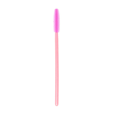 Image of a disposable pink silicon brush wand for eyelashes and brows in a white background.